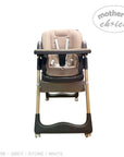 Beige and black high chair with 'Mother's Choice' branding on a white background