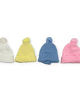 Four colorful knit baby hats with pom-poms on a white background