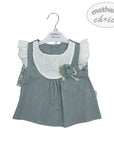 Children's dress with floral details on a hanger, branded 'mother's choice'.