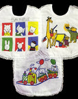 Three baby bibs with colorful cartoon designs on a white background