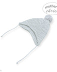 Knitted baby hat with pom-pom on a white background, branded 'Mother's Choice'.