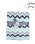 Chevron patterned blanket with gray ribbon and 'Mother's Choice' tag on a white background
