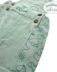 Green baby romper with dinosaur pattern and brown buttons, branded 'Mother's Choice'.
