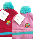 Two colorful beanies with pom-poms and butterfly logos on a white background