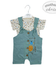 Children's outfit with green overalls and polka dot shirt on a white background