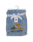 Blue checkered blanket with dinosaur designs and a bow on a white background