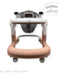 Baby walker with pink base and white top on a white background, featuring 'Mother's Choice' branding.
