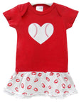 Red baby dress with a heart design on a white background