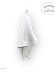 Gray towel draped over a white background with 'mother's choice' branding.