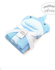 Folded blue towel with shark design and white bow, branded 'Mother's Choice', on a white background.