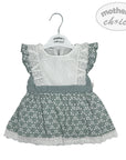 Baby dress with floral pattern and lace details on a white background, featuring 'mother's choice' branding.
