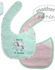 Baby bib with unicorn design and matching pouch on a white background