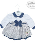 Baby dress with blue collar and bow on a white background, branded 'Mother's Choice'.
