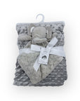 Gray elephant plush toy and blanket set on a white background