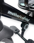 Close-up of a stroller with 'mother's choice' branding on a white background
