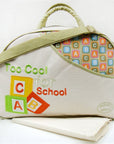 Children's bag with 'Too Cool for School' and alphabet design on a white background