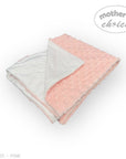Pink and white baby blanket with 'Mother's Choice' branding on a white background