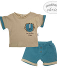 Children's outfit with beige shirt and blue shorts featuring a lion design on a white background.