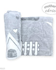 Gray baby blanket with white designs on a white background