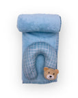 Blue travel pillow with bear face on a white background