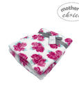 Floral patterned blanket with a gray ribbon on a white background, branded 'Mother's Choice'.