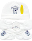 Set of white baby booties with blue paw print design on a white background