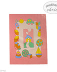 Children's play mat with colorful toy illustrations on a pink background, featuring the brand 'Mother's Choice'.