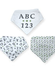 Three baby bibs with ABC, 123, and alphabet patterns on a white background