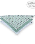 Triangle-shaped mat with geometric pattern on a white background, branded 'Mother's Choice'.