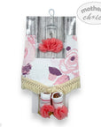 Baby girl's floral headband, bib, and booties set with 'mother's choice' branding on a white background.