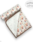 Baby blanket with floral pattern and brown border on a white background, featuring 'mother's choice' branding.