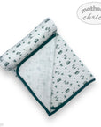 Folded baby blanket with vehicle pattern on a white background, featuring 'Mother's Choice' branding.