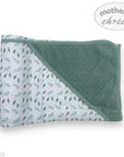 Baby blanket with floral pattern on one side and solid color on the other, branded 'Mother's Choice'.
