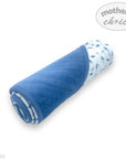 Rolled-up blue blanket with a patterned edge on a white background, featuring 'Mother's Choice' branding.