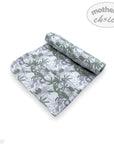 Floral-patterned blanket with rolled-up design on a white background, featuring 'mother's choice' branding.