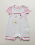 Baby romper with pink sleeves on a light gray background