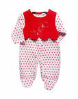 Baby romper with red top and white polka dot pants on a white background