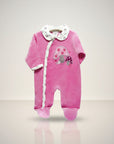 Pink baby onesie with mushroom design on a light gray background