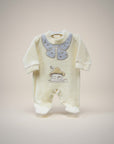 Baby onesie with a cartoon design on a beige background
