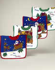 Set of Christmas-themed baby bibs on a light gray background