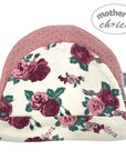 Floral-patterned baby hat with pink trim on a white background, featuring 'mother's choice' branding.
