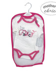 Baby onesie with pink accents and text in a packaging bag on a white background