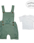 Green children's overalls with dinosaur design and white t-shirt on a light gray background, featuring 'mother's choice' branding.