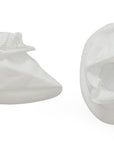 Two white baby booties on a white background