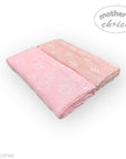 Two pink baby blankets with white patterns on a white background, branded 'Mother's Choice'.
