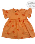 Orange dress with floral patterns on a white background, featuring 'mother's choice' branding.