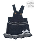 Denim pinafore dress with ruffles and a bow on a white background, featuring 'mother's choice' branding.