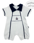 White baby romper with navy collar and sailboat design on a white background, featuring 'mother's choice' branding.