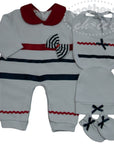 Baby outfit set with gray romper, bib, hat, and socks on a white background