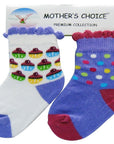 Two pairs of children's socks with colorful patterns on a 'Mother's Choice' branded card.